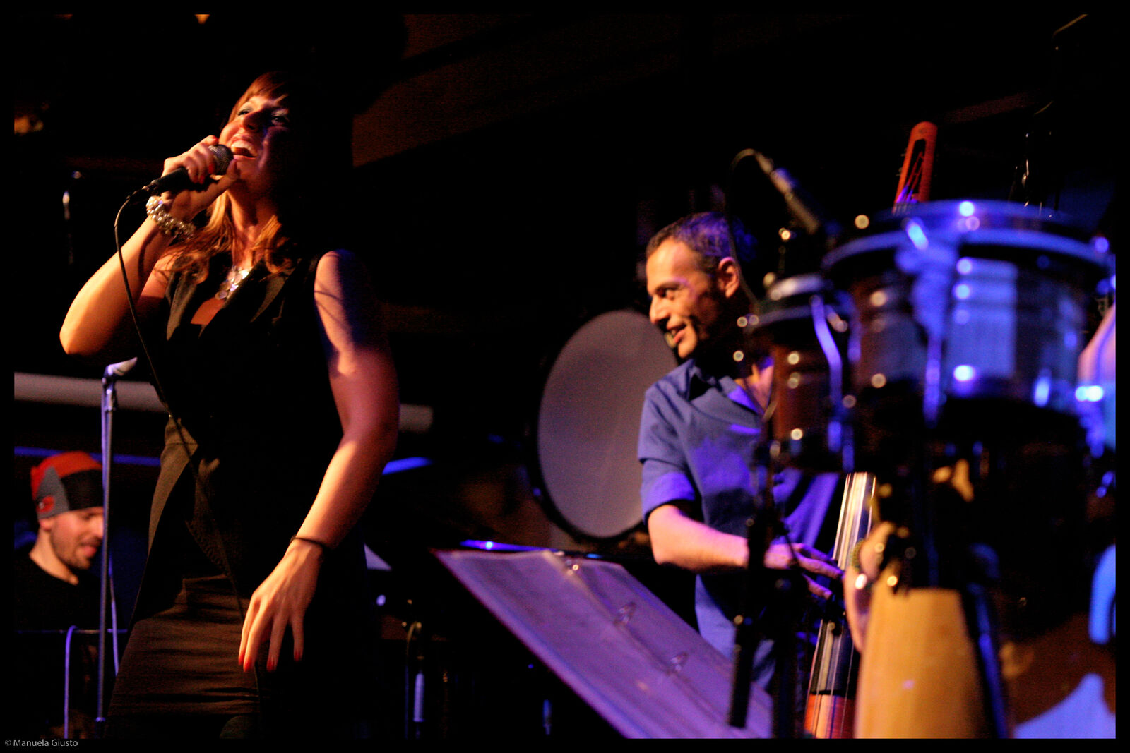 A vocalist and Claudio in purple light, 2009